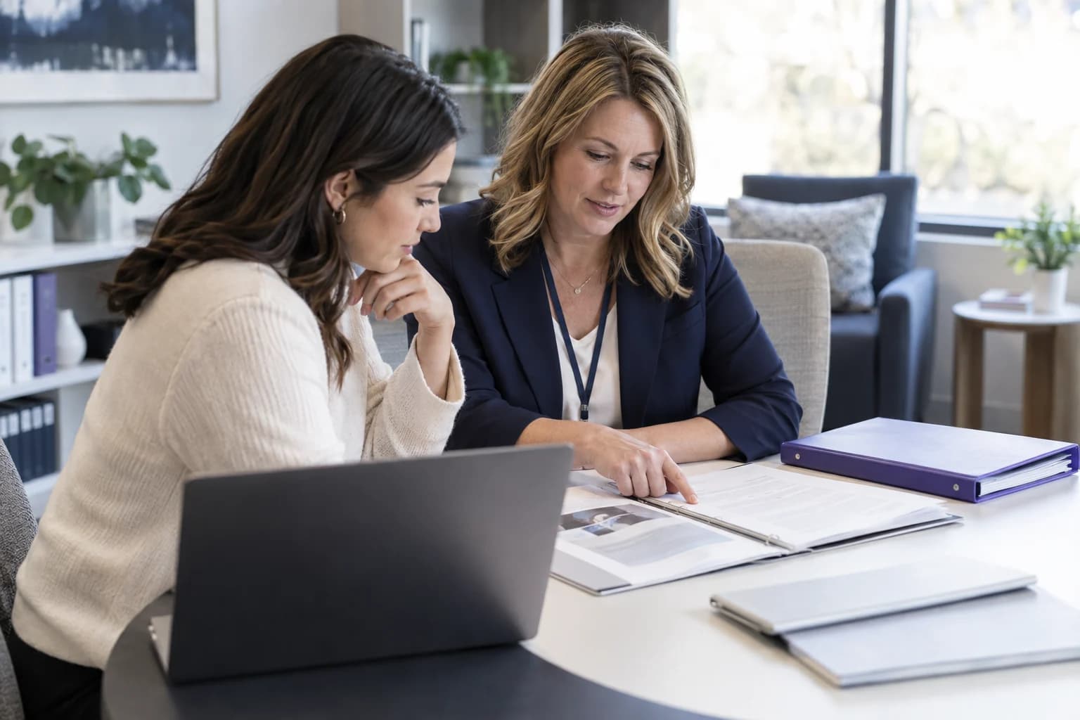 AI-generated scene of an employee and HR specialist reviewing approved workforce information.